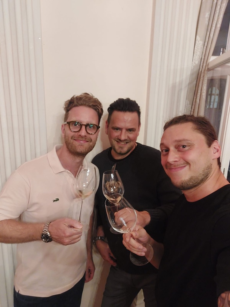 MaxiRiedelUltras founders Olli, Tobi and Herb Schilder holding Riedel wine glasses